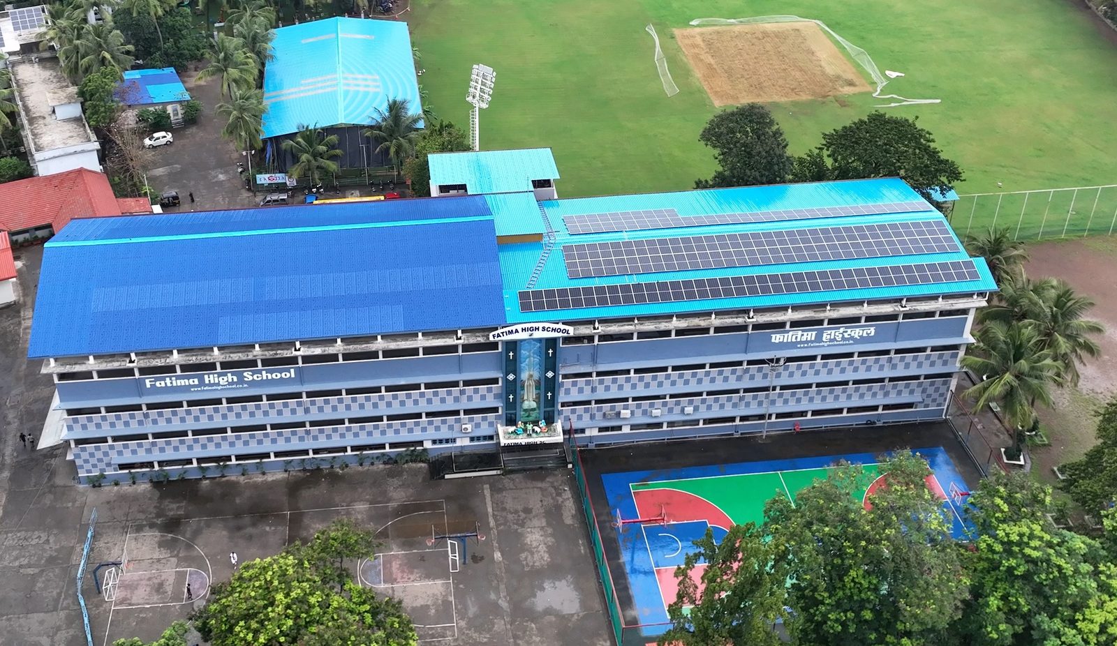 Fatima High School Vidyavihar building with rooftop solar panels and signage visible