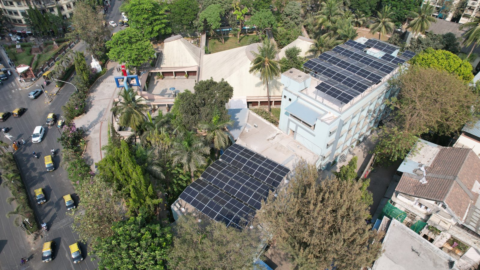 Wider view of Portuguese Church Dadar campus showing solar installation